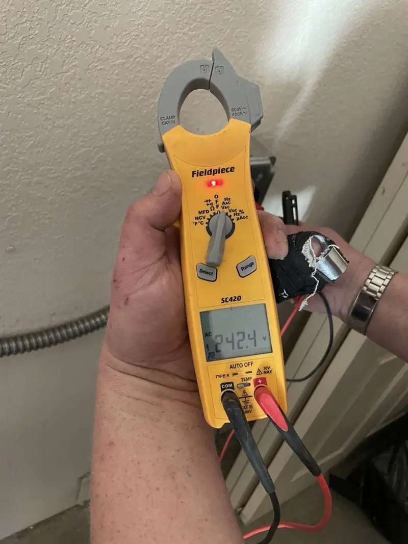 Voltage testing with clamp meter during Ceiling Fan Installation in New Prague